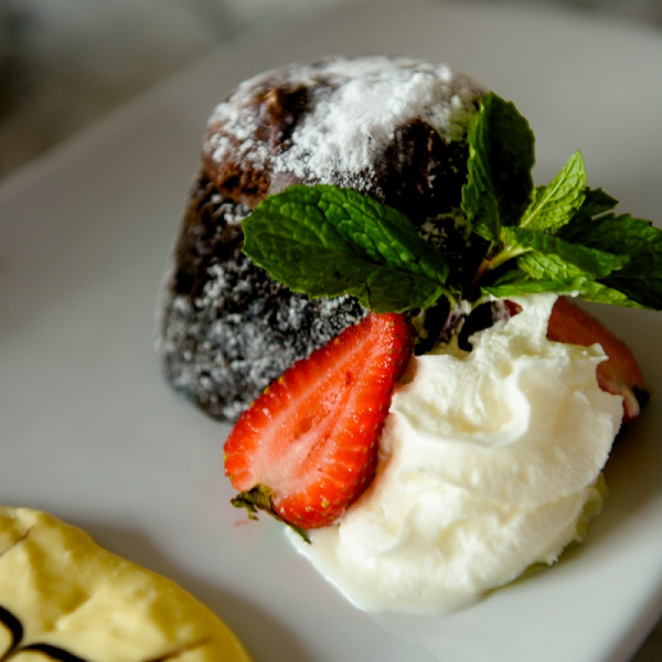 Chocolate Lava Cake dessert with gelato and strawberries at Galliano Italian Restaurant Gambrills.