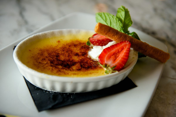 Creme Brulee topped with strawberries, mint, and cream at Galliano Italian Restaurant in Gambrills.