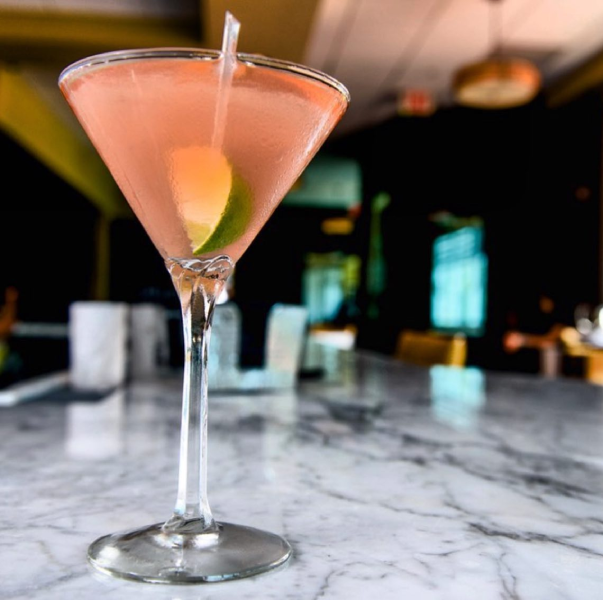 Elegant pink cocktail in a martini glass